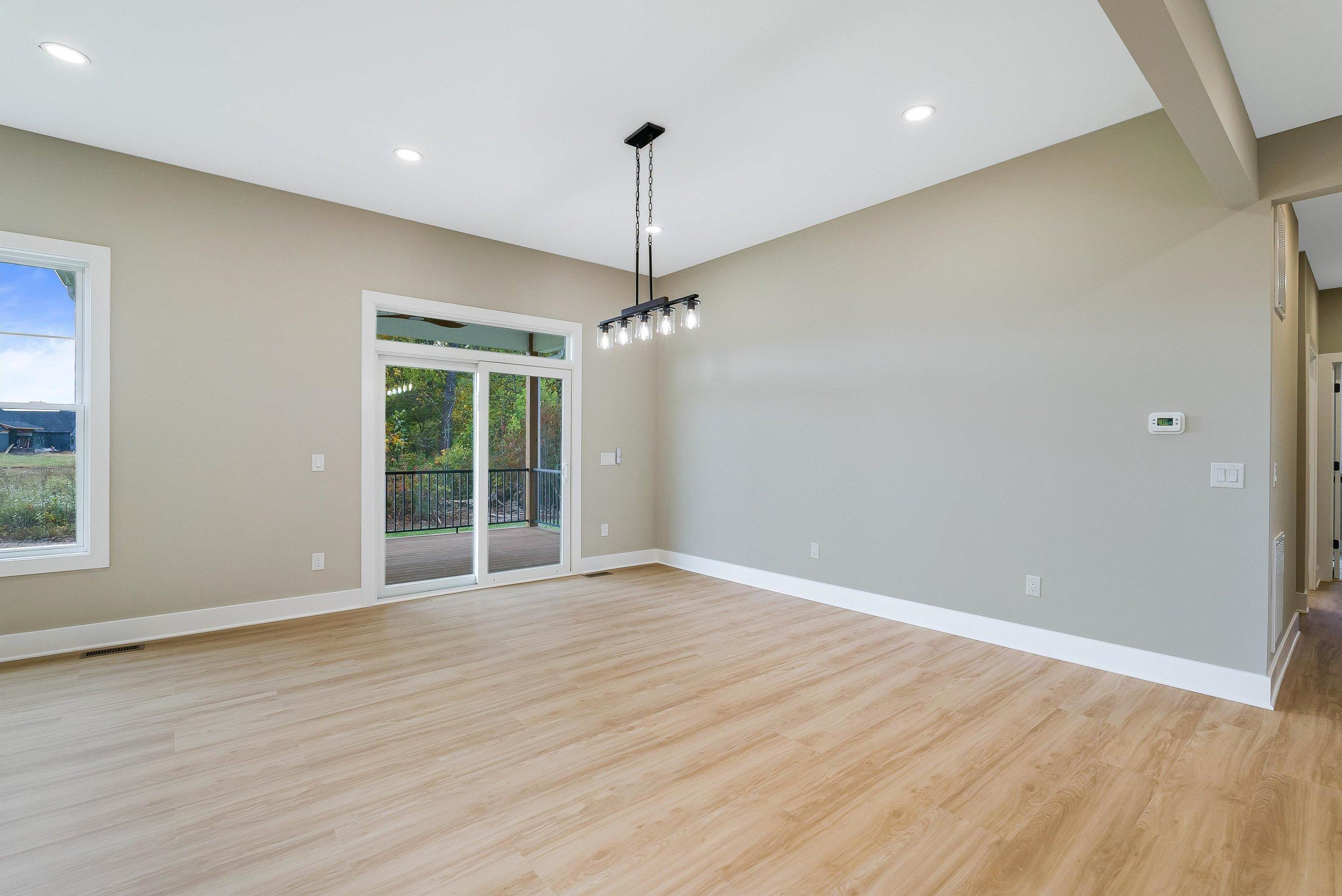 4935 Boxer Loop McGaheysville, VA 22840 - Photo 21 of 60 a view of an empty room with wooden floor and a window
