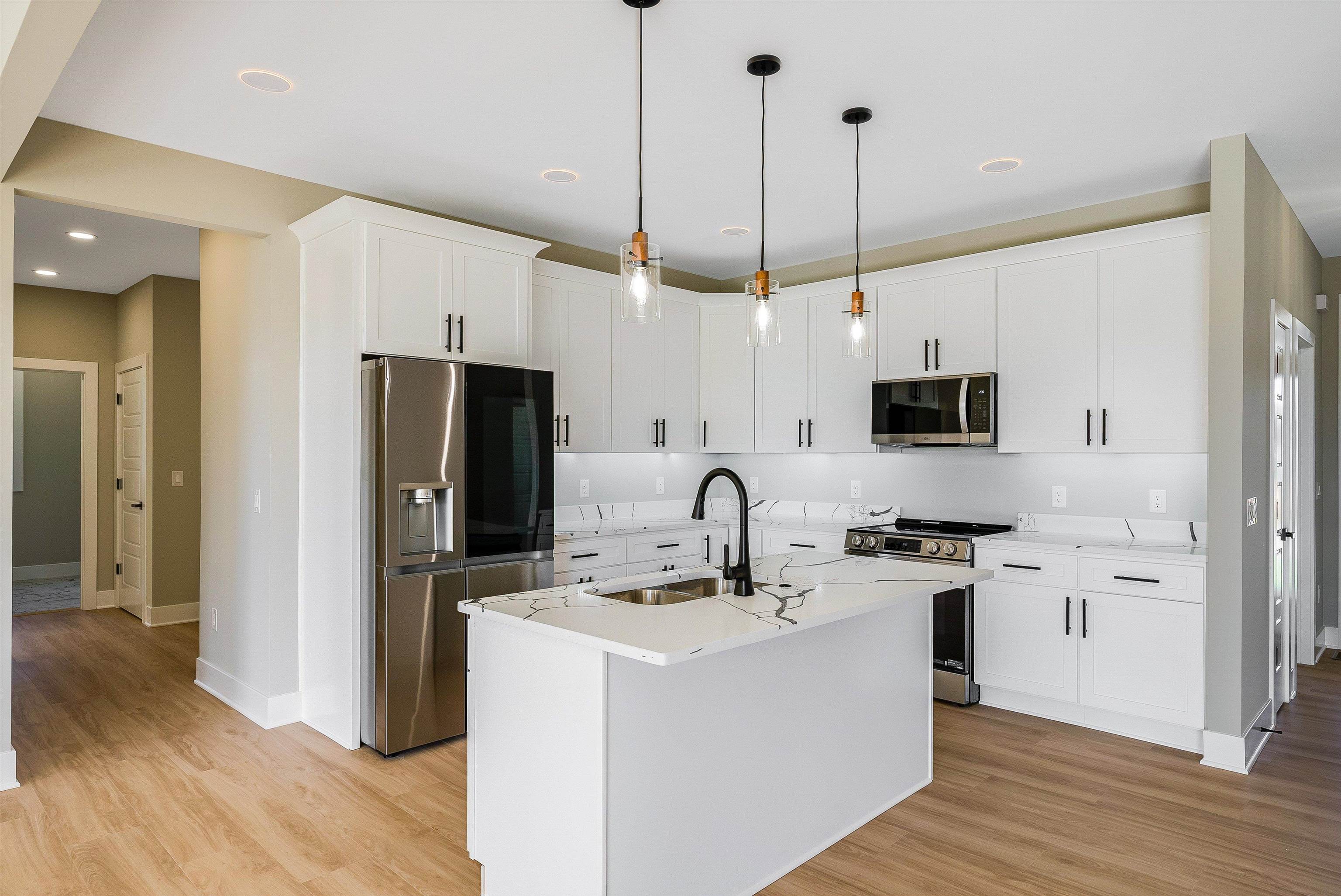 4935 Boxer Loop McGaheysville, VA 22840 - Photo 26 of 60 a kitchen with a sink a counter space appliances and cabinets