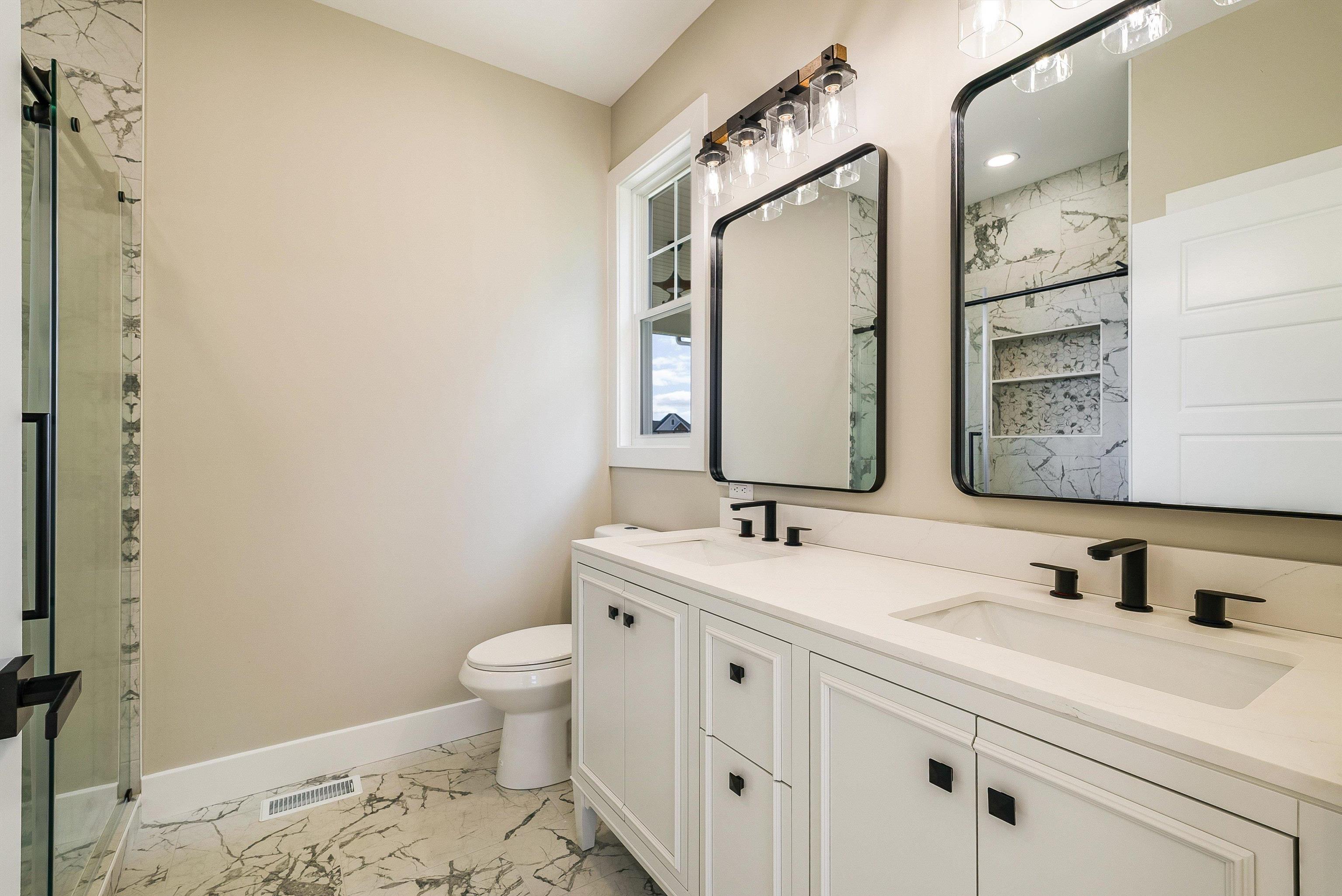 4935 Boxer Loop McGaheysville, VA 22840 - Photo 31 of 60 a bathroom with a sink a toilet and a mirror