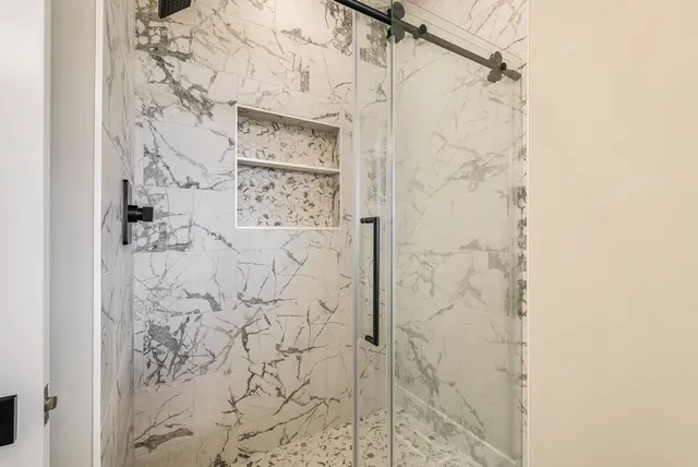 a bathroom with a sink toilet and a mirror