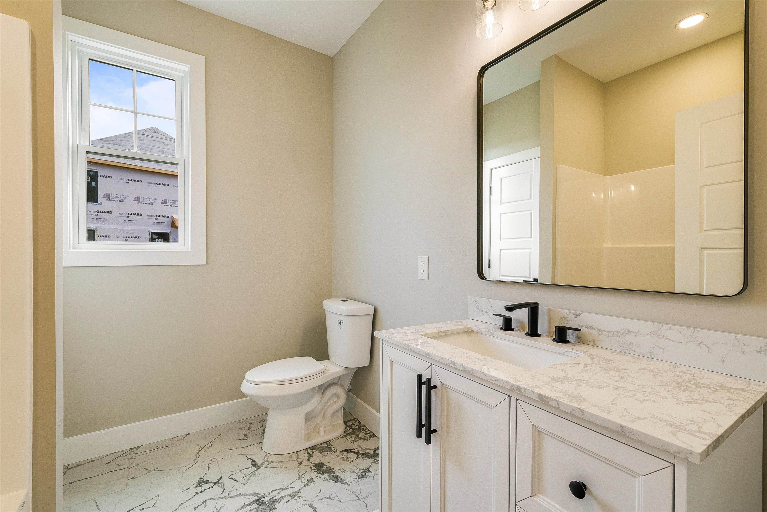 4935 Boxer Loop McGaheysville, VA 22840 - Photo 46 of 60 a bathroom with a granite countertop sink toilet and mirror