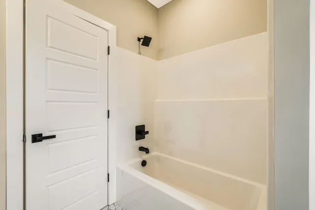 a view of a house with pool and chairs