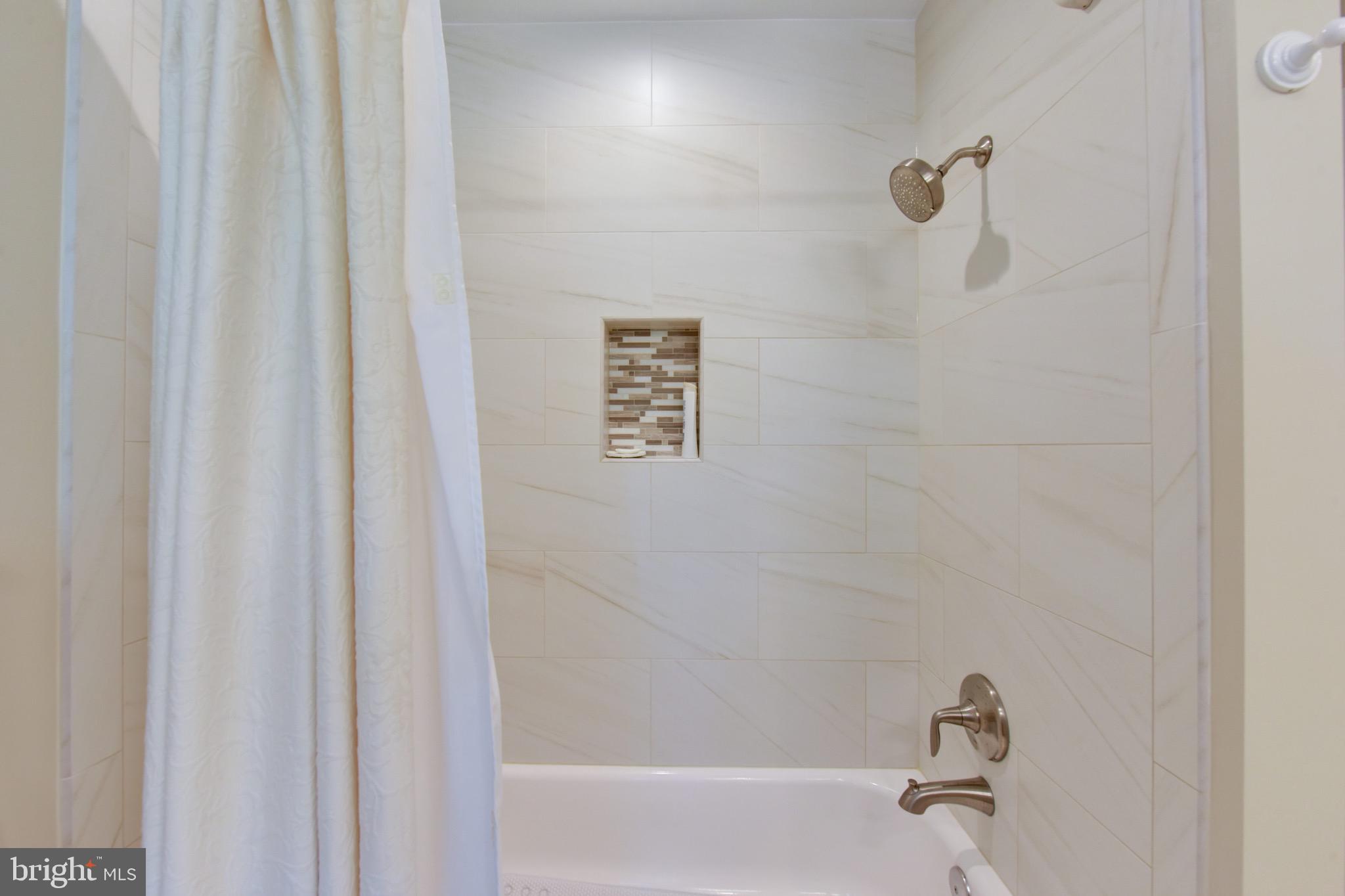 1609 Stonebridge Road Alexandria, VA 22304 - Photo 40 of 53 Fine tilework; excellent lighting