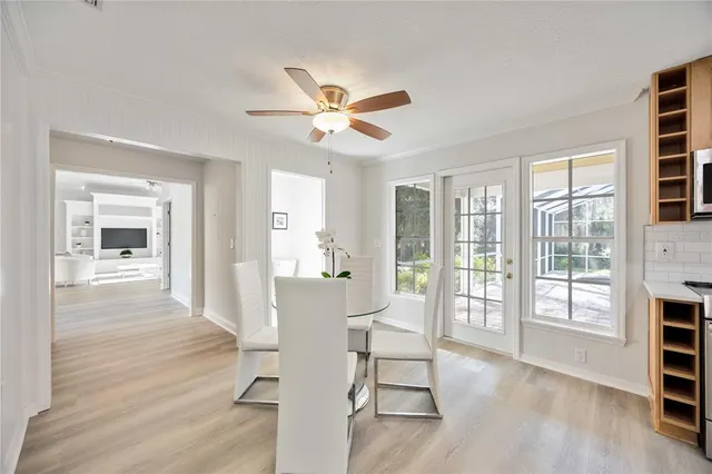 a living room with stainless steel appliances kitchen island granite countertop furniture and a kitchen view