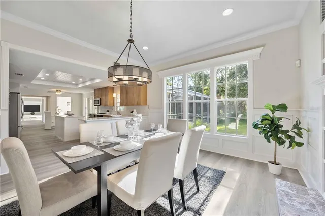 a view of a dining room with furniture window and wooden floor