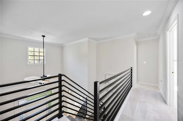 a bedroom with a large bed and a large window