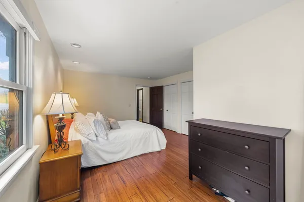a living room with furniture and a dresser