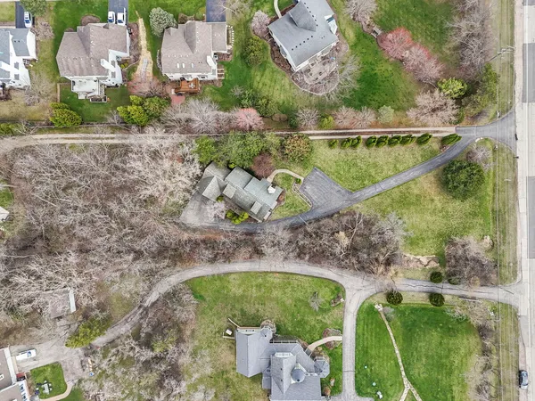 an aerial view of a house with outdoor space