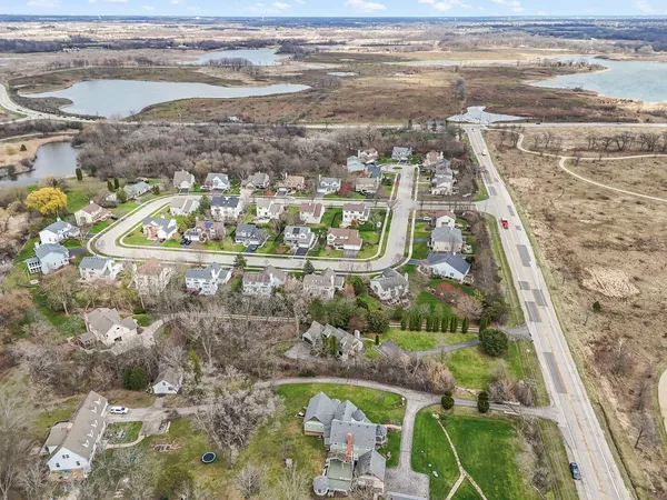 an aerial view of a house with garden space and street view