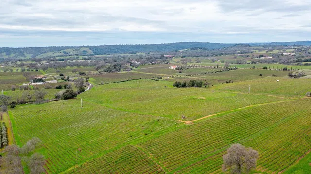 an aerial view of a houses with a outdoor space