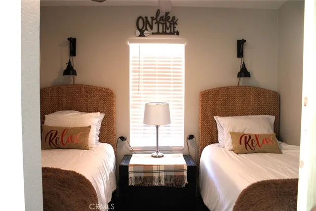 a bedroom with a bed and window