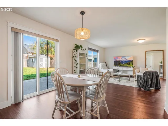 a kitchen with granite countertop a stove a sink and a refrigerator