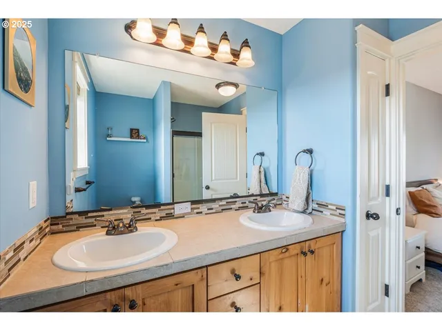 a picture of a bathroom with a shower