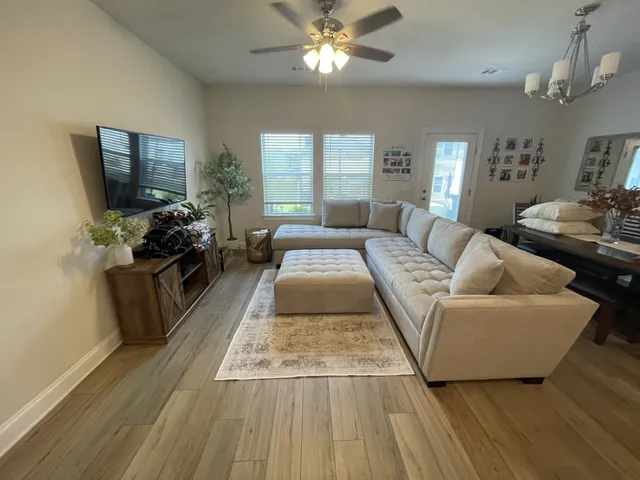 a living room with furniture and a flat screen tv