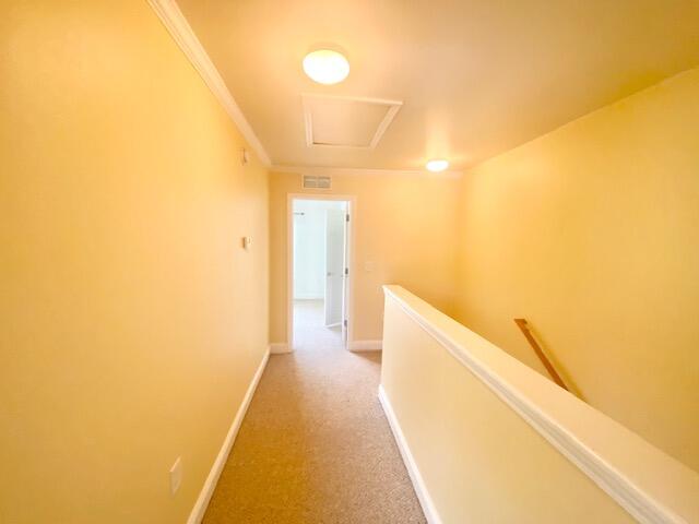 514 Wingspan Way Crestview, FL 32536 - Photo 11 of 20 a view of a hallway with wooden floor