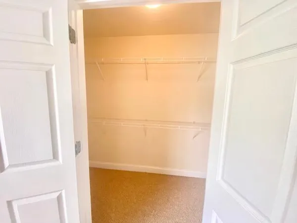 a view of a small space with racks on the wall