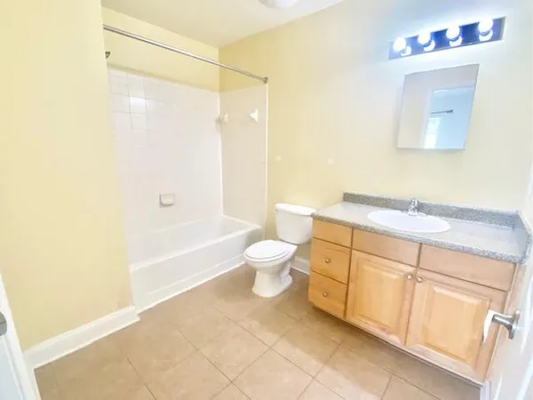 a bathroom with a sink a toilet and a bathtub