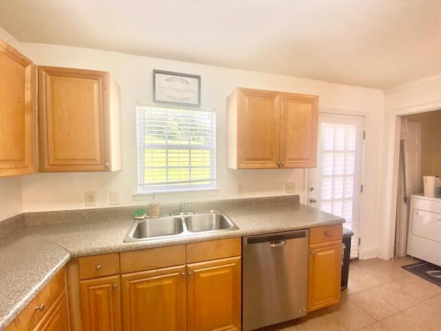 514 Wingspan Way Crestview, FL 32536 - Photo 7 of 20 a kitchen with stainless steel appliances granite countertop a sink dishwasher a refrigerator and cabinets with wooden floor