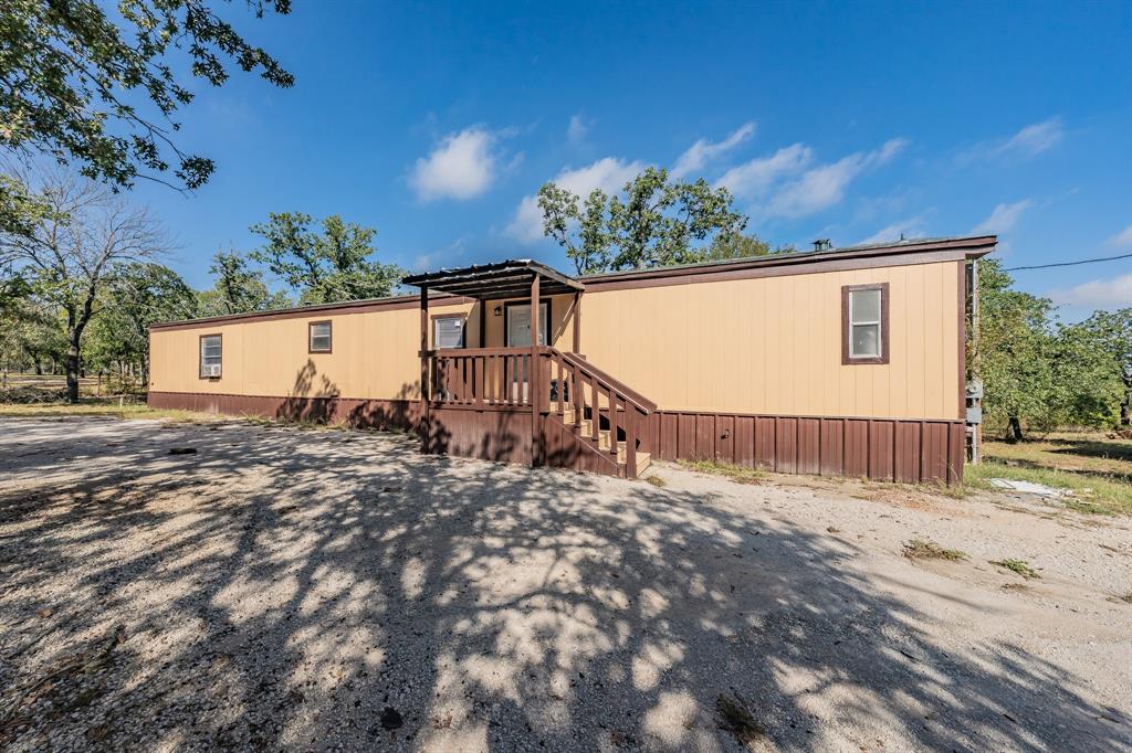 417 Wood River Road Millsap, TX 76066 - Photo 15 of 40 a view of a house with a yard