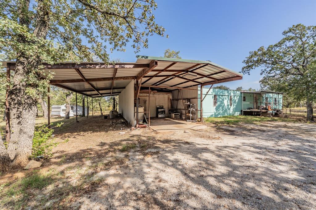 417 Wood River Road Millsap, TX 76066 - Photo 27 of 40 a view of a chairs and table in the patio