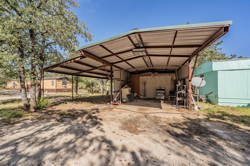 417 Wood River Road Millsap, TX 76066 - Photo 28 of 40 a view of a room with wooden roof and windows