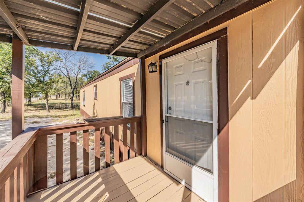417 Wood River Road Millsap, TX 76066 - Photo 4 of 40 a view of balcony with wooden floor
