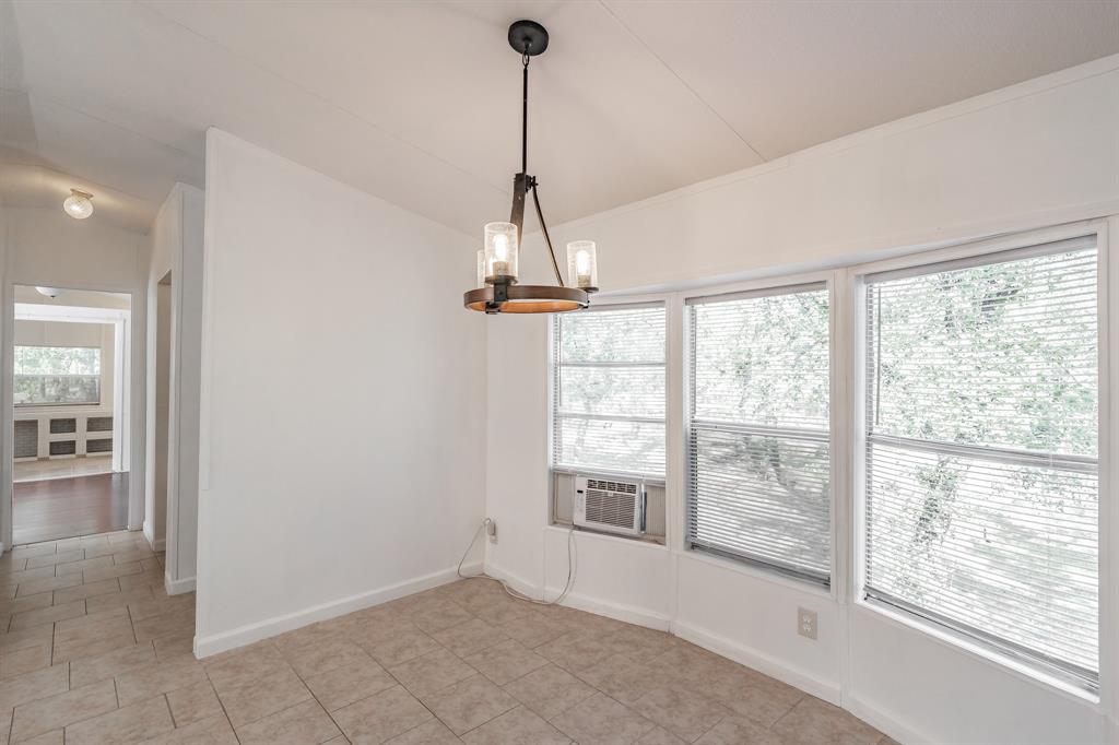417 Wood River Road Millsap, TX 76066 - Photo 9 of 40 a view of an empty room with a window