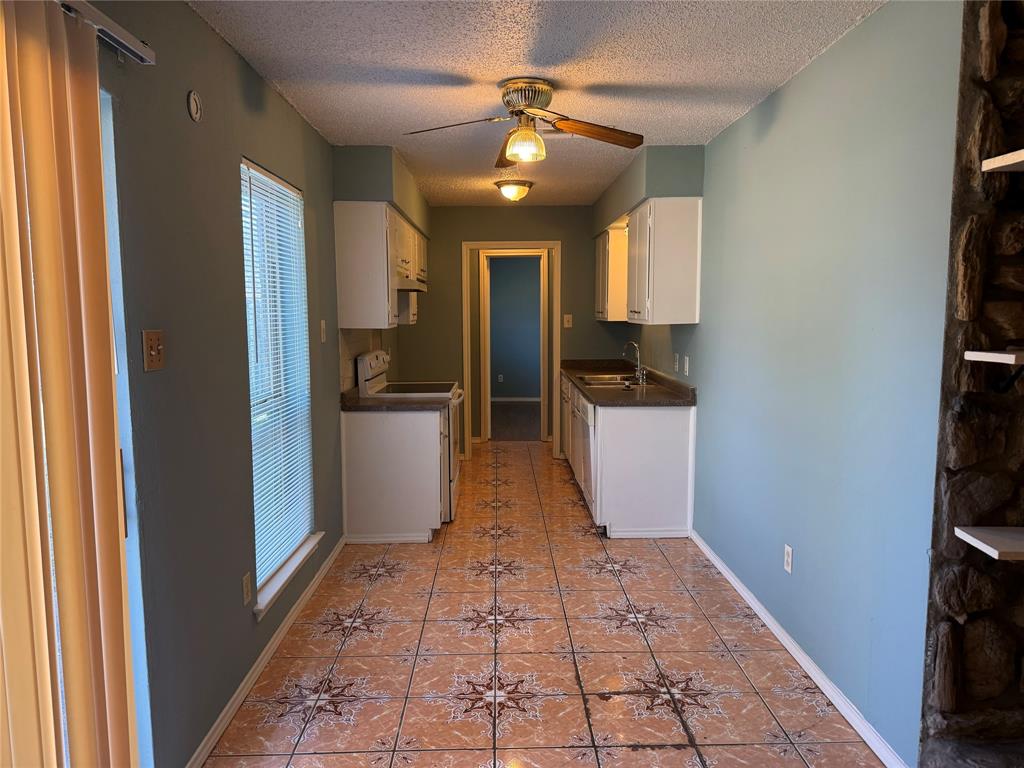 2414 March Lane Grand Prairie, TX 75050 - Photo 5 of 15 a view of a hallway to a livingroom and a window