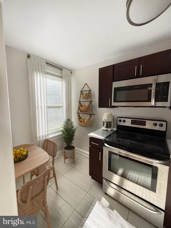 a kitchen with a stove and a microwave