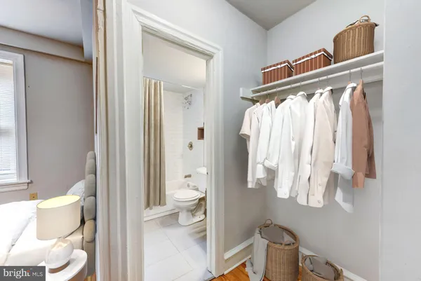 a bathroom with a toilet sink and tub