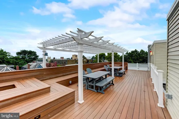 a view of a patio with couches table and chairs