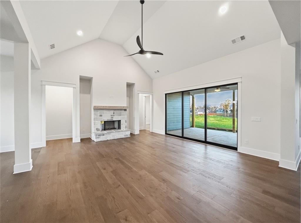 303 Eminence Peak Rydal, GA 30171 - Photo 22 of 73 a view of an empty room with wooden floor fireplace and a window