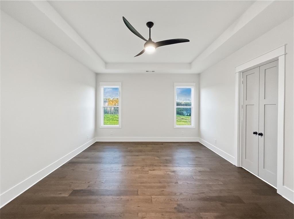303 Eminence Peak Rydal, GA 30171 - Photo 37 of 73 wooden floor in an empty room with a window