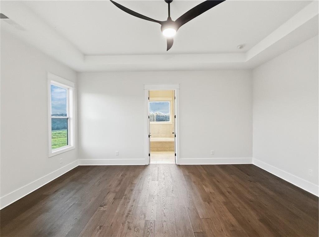 303 Eminence Peak Rydal, GA 30171 - Photo 38 of 73 an empty room with wooden floor and windows
