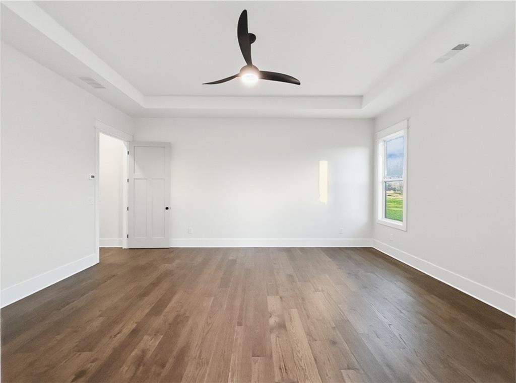 303 Eminence Peak Rydal, GA 30171 - Photo 39 of 73 a view of an empty room with wooden floor and a window