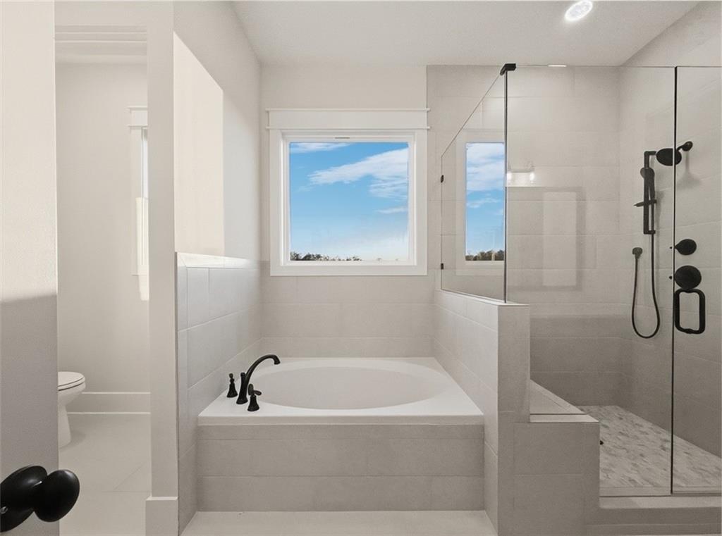 303 Eminence Peak Rydal, GA 30171 - Photo 42 of 73 a bathroom with a tub and a shower