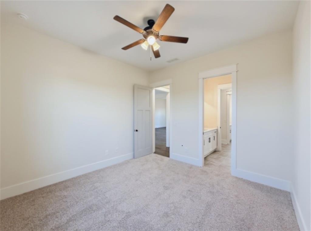 303 Eminence Peak Rydal, GA 30171 - Photo 56 of 73 an empty room with closet and ceiling fan
