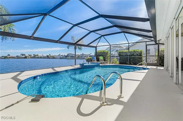 a view of a swimming pool with a patio