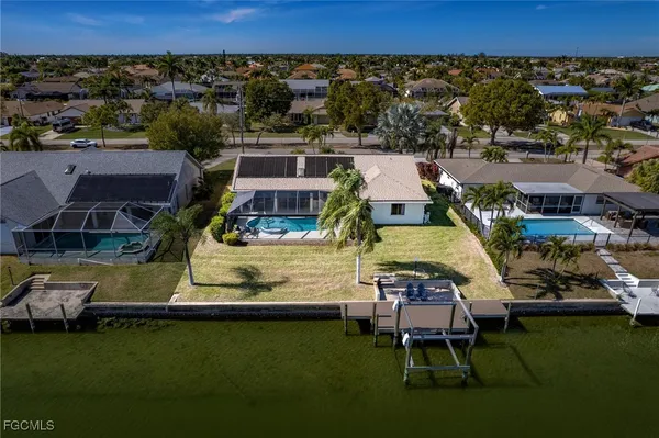 an aerial view of a house with a ocean view
