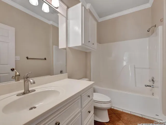 a bathroom with a sink vanity and a mirror