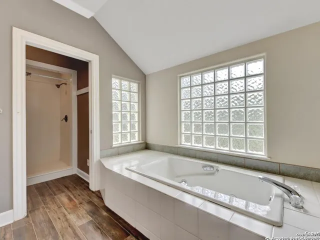 a view of a swimming pool with a patio