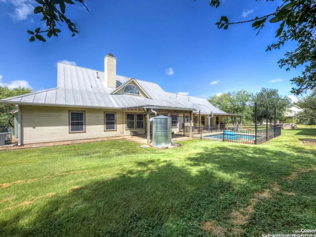 a kitchen with granite countertop cabinets stainless steel appliances and a sink