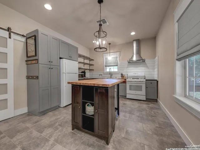 a view of a house with a garden