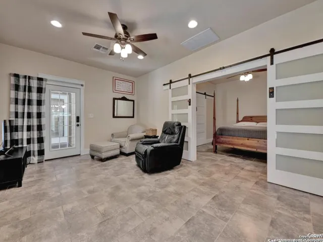 a view of small garden in the backyard with sitting area