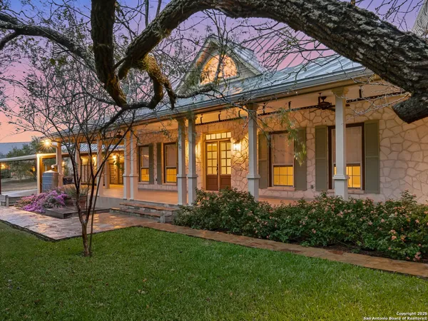 a view of a house with garden and patio