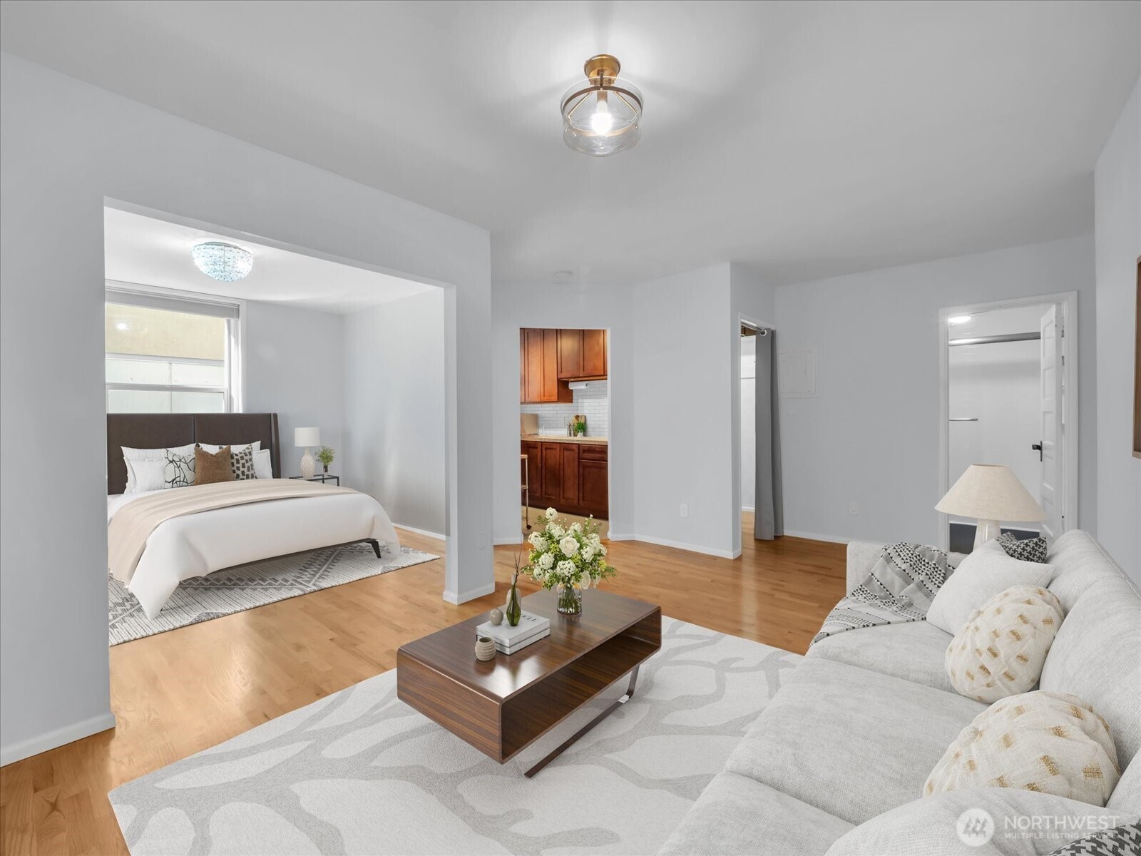 7 Harrison Street, Unit 17 Seattle, WA 98109 - Photo 1 of 20 a bedroom with a bed couches and view of living room