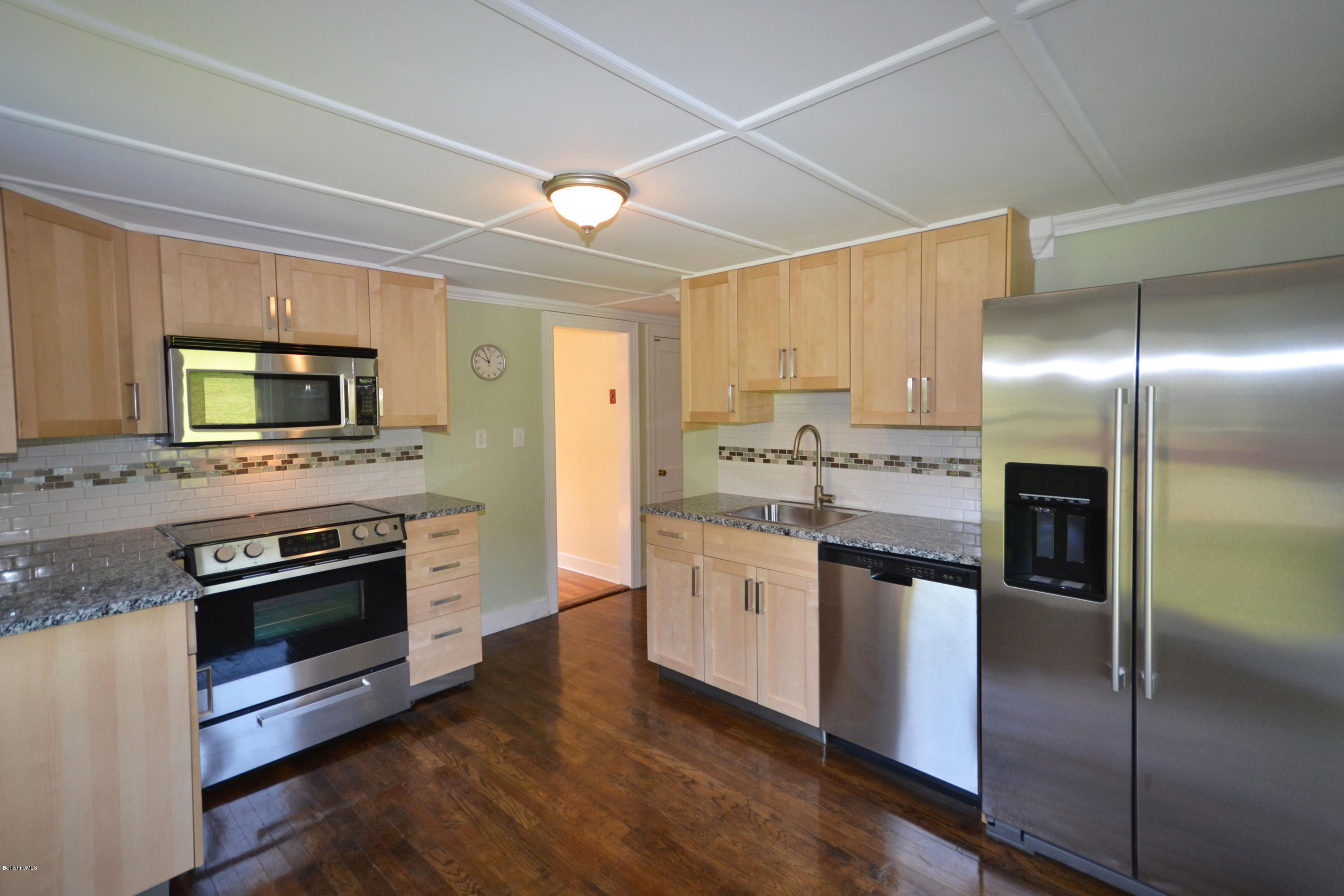 2127 Hancock Road Hancock, MA 01267 - Photo 14 of 53 a kitchen with stainless steel appliances granite countertop a refrigerator a stove and a sink