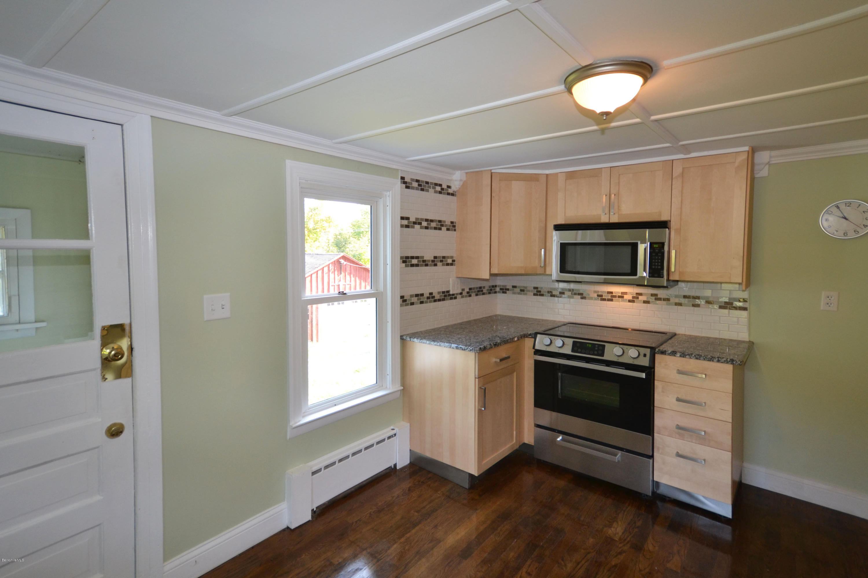 2127 Hancock Road Hancock, MA 01267 - Photo 16 of 53 a kitchen with granite countertop a stove top oven and sink