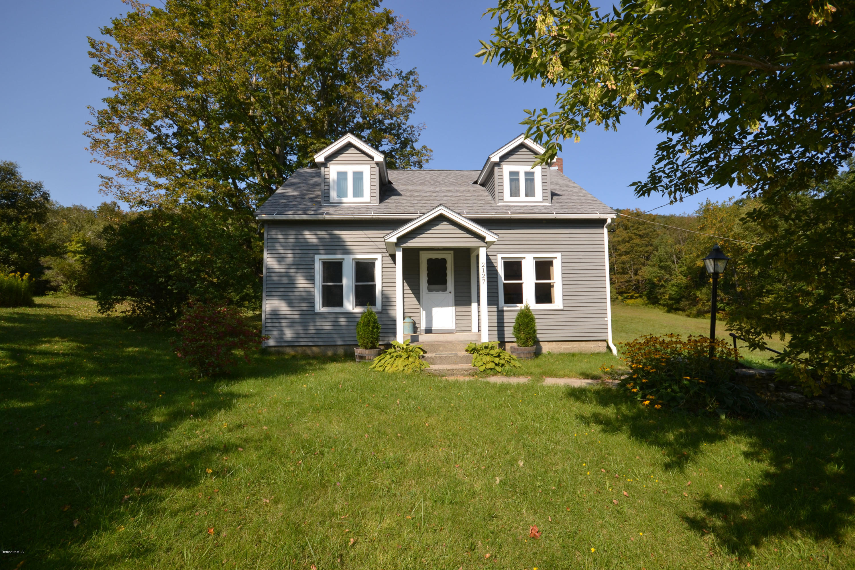 2127 Hancock Road Hancock, MA 01267 - Photo 3 of 53 a front view of a house with a garden