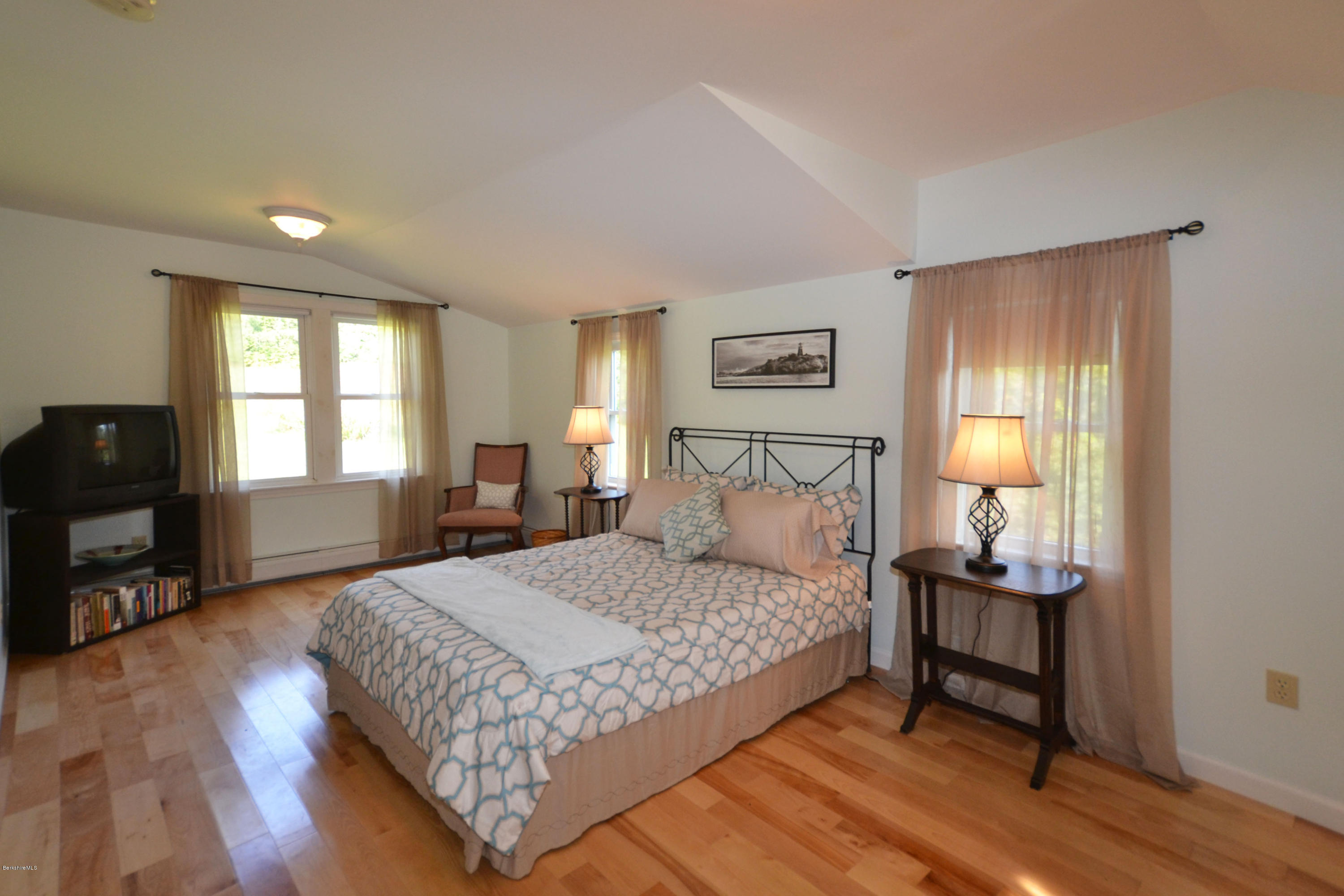 2127 Hancock Road Hancock, MA 01267 - Photo 26 of 53 a bedroom with a bed and wooden floor